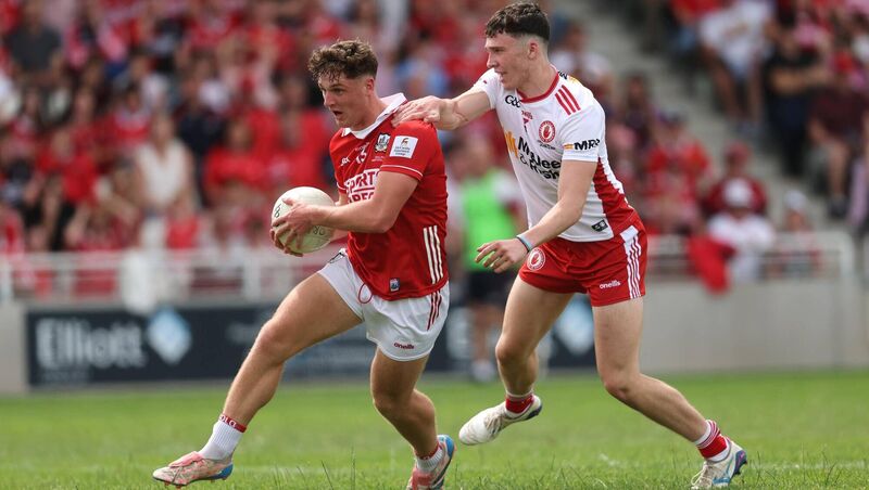 Cork's Tom Whooley powers past the Tyrone challenge of Matthew J Daly. Picture: Bryan Keane/INPHO