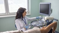 Young woman is doing a breast ultrasound for preventive breast cancer care