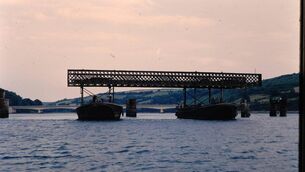 <p>Barges lifting off the spans of the old Youghal bridge, with the new bridge in the background</p> <p>Barges lifting off the spans of the old Youghal bridge, with the new bridge in the background</p>