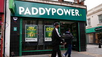 Boss of Paddy Power owner to step down after forecasts cut
