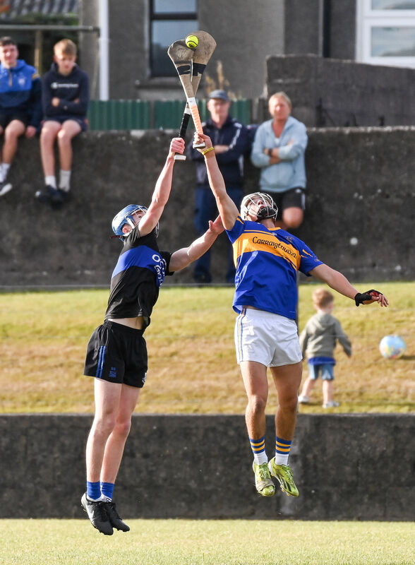 Carrigtwohill's Tom Walsh and Sarsfields' Seán Sheehan compete in the air during their Premier 1 MHC clash at Carrigtwohill. Picture: David Keane Carrigtwohill's Tom Walsh and Sarsfields' Seán Sheehan compete in the air during their Premier 1 MHC clash at Carrigtwohill. Picture: David Keane