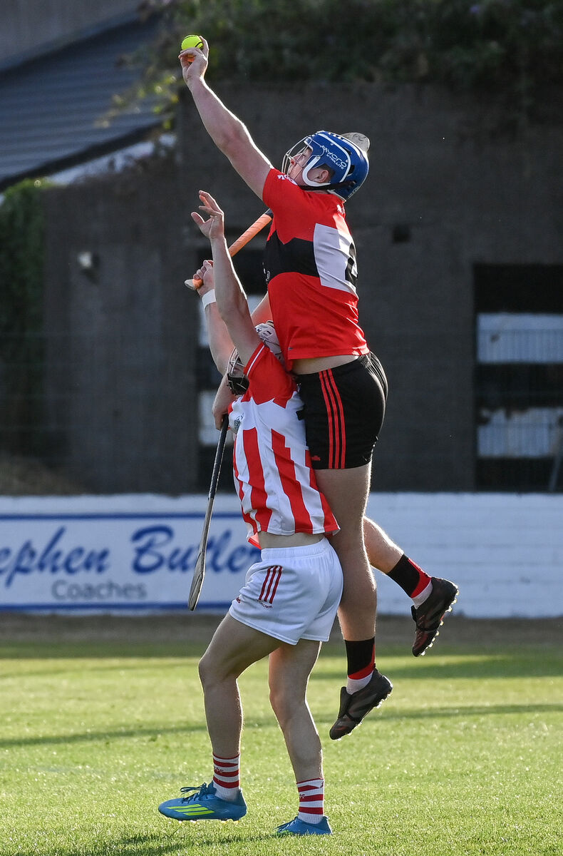 UCC's Kevin Beechinor goes high to win possession ahead of Imokilly's Sean O'Donoghue. Picture: David Keane. UCC's Kevin Beechinor goes high to win possession ahead of Imokilly's Sean O'Donoghue. Picture: David Keane.