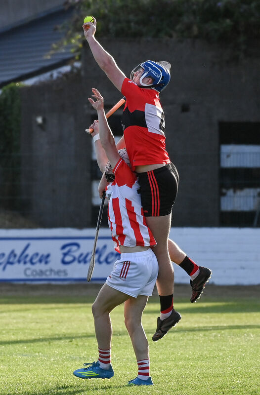 UCC's Kevin Beechinor goes high to win possession ahead of Imokilly's Sean O'Donoghue. Picture: David Keane. UCC's Kevin Beechinor goes high to win possession ahead of Imokilly's Sean O'Donoghue. Picture: David Keane.