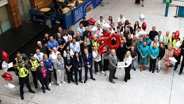<p>Staff at Cork Airport gather to mark 20 years since the opening of the new terminal building and the two millionth passenger of 2026. Picture: Cork Airport. </p>