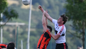 <p> Duhallow's Colin Walsh and UCC's Tommy O'Sullivan, compete in the air. Picture: David Keane</p> <p> Duhallow's Colin Walsh and UCC's Tommy O'Sullivan, compete in the air. Picture: David Keane</p>
