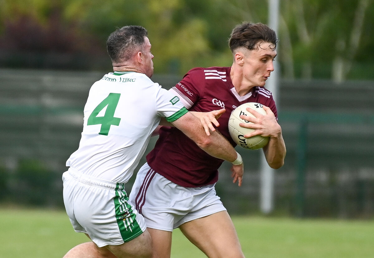  Bishopstown's Gary Holland keeps possession under pressure from Kanturk's Lorcan O'Neill. Picture: David Keane