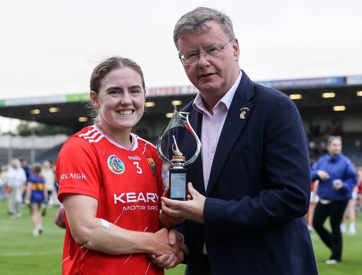 Libby Coppinger is presented with the player of the match award by Brian Molloy, president Camogie Association, after the Glen Dimplex All-Ireland senior camogie championship semi-final at FBD Semple Stadium. Picture: INPHO/Bryan Keane