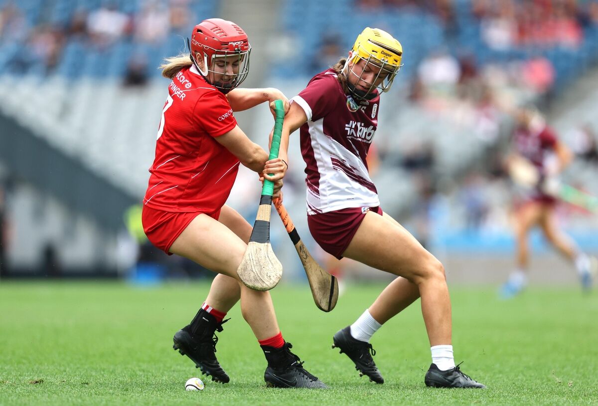 Cork's Libby Coppinger and Emma Helebert of Galway tussle for possession during last year's 
