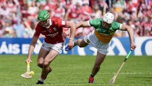 <p>Cork hurler Brian Roche sails past Offaly's Ross Ravenhill in the All-Ireland quarter-final at Semple Stadium. Picture: Noel Sweeney</p>