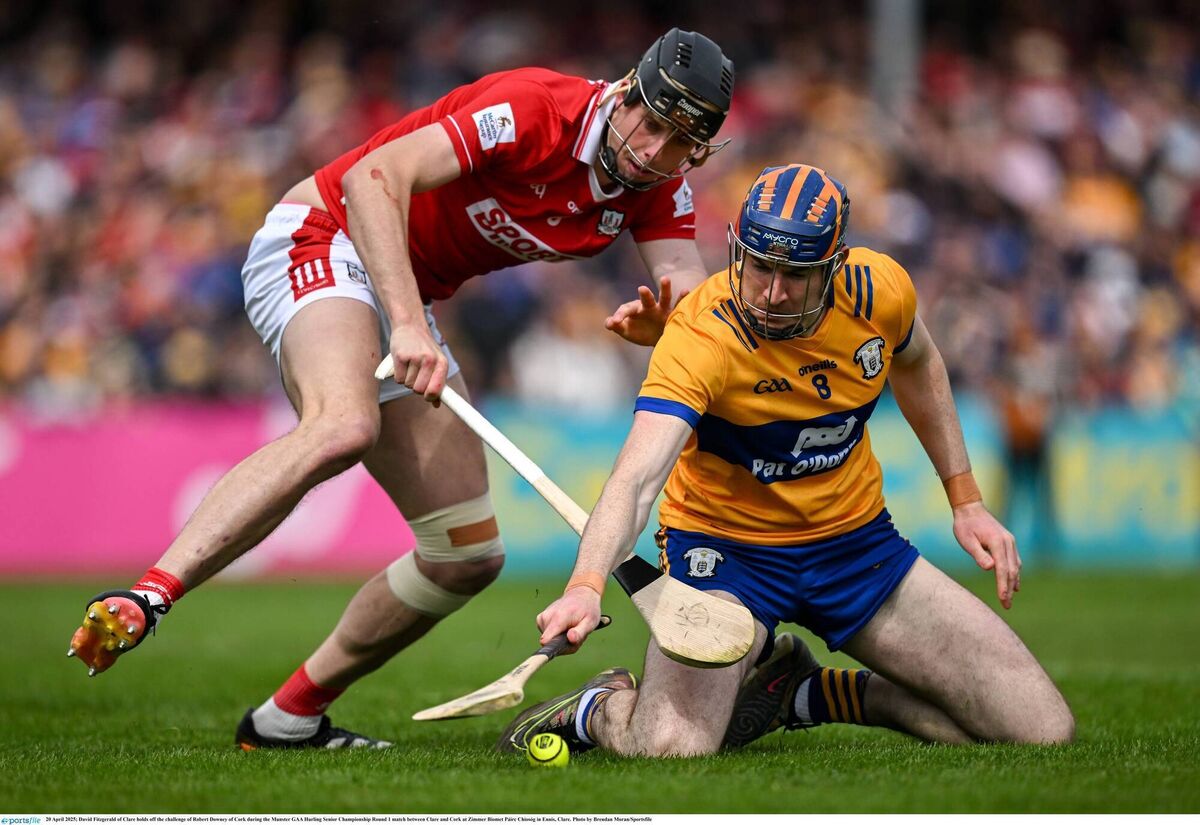 David Fitzgerald of Clare holds off the challenge of Robert Downey of Cork in Ennis last year. Picture: Brendan Moran/Sportsfile David Fitzgerald of Clare holds off the challenge of Robert Downey of Cork in Ennis last year. Picture: Brendan Moran/Sportsfile