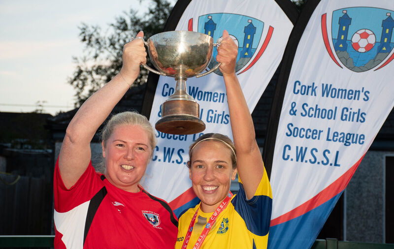 Douglas Hall captain Emma McCarthy holds aloft the CWSSL Challenge Cup trophy with Sarah Scanlon of the CWSSL following the recent Challenge Cup Final which was played in St Colman's Park. Picture: Howard Crowdy Douglas Hall captain Emma McCarthy holds aloft the CWSSL Challenge Cup trophy with Sarah Scanlon of the CWSSL following the recent Challenge Cup Final which was played in St Colman's Park. Picture: Howard Crowdy