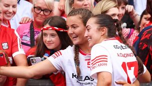 <p>Cork's Ava Fitzgerald and Amy O’Connor take a selfie with supporters after the game. Picture: INPHO/Tom Maher</p>