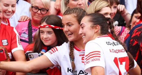 Ava Fitzgerald and Amy O’Connor take a selfie with supporters after the game 9/8/2026