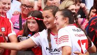Ava Fitzgerald and Amy O’Connor take a selfie with supporters after the game 9/8/2026
