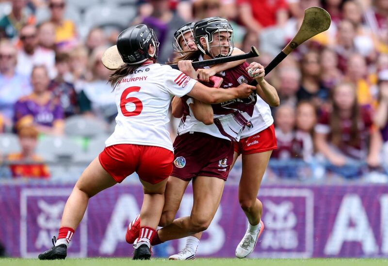 Galway's Carrie Dolan comes up against Izzy O'Regan and Méabh Murphy of Cork. Picture: INPHO/Grace Halton