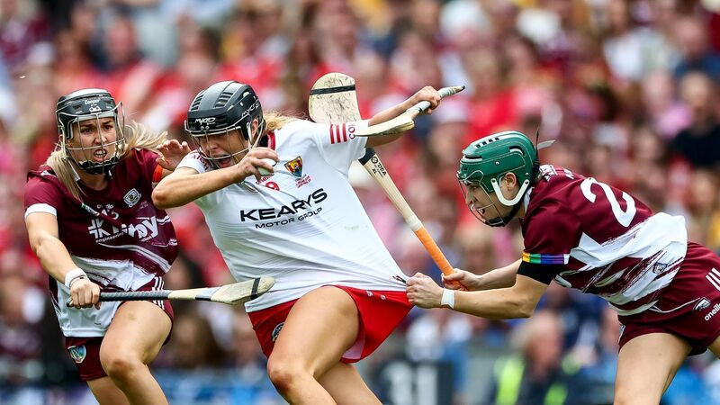 Cork's Laura Hayes is tackled by Galway's Niamh Niland and Niamh Mallon. Picture: INPHO/James Crombie