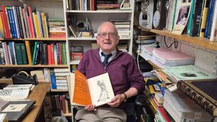 <p>Jim Cooney with one of the 35,000 tomes in his bookshop in Macroom</p> <p>Jim Cooney with one of the 35,000 tomes in his bookshop in Macroom</p>