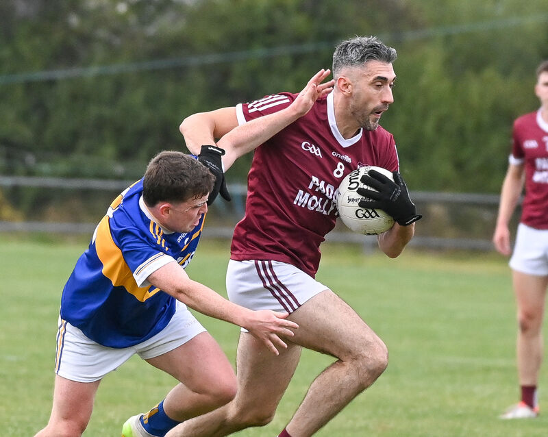  Rockchapel's Seamus Hickey is tackled by Kilshannig's Conor Murphy. Picture: David Keane
