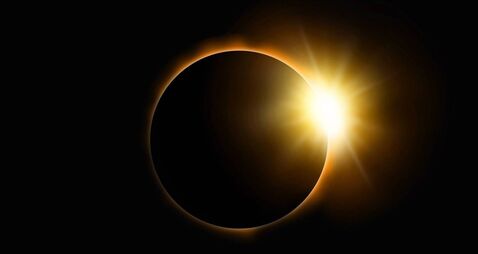 iStock-2068493211.jpg Solar Eclipse on black sky background