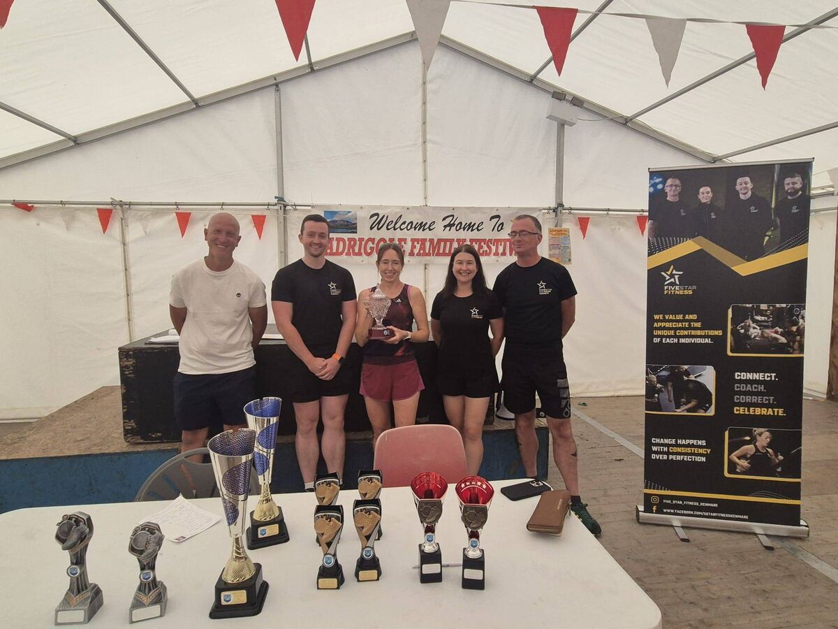 Adrigole GAA chairperson Fergus Carey, Shane O'Sullivan of Five Star Fitness, Julie O' Brien of Durrus AC - the first female athlete home in the Adrigole GAA Five-Mile Run - and Julia Romanovska and Eric Cantwell of Five Star Fitness. 