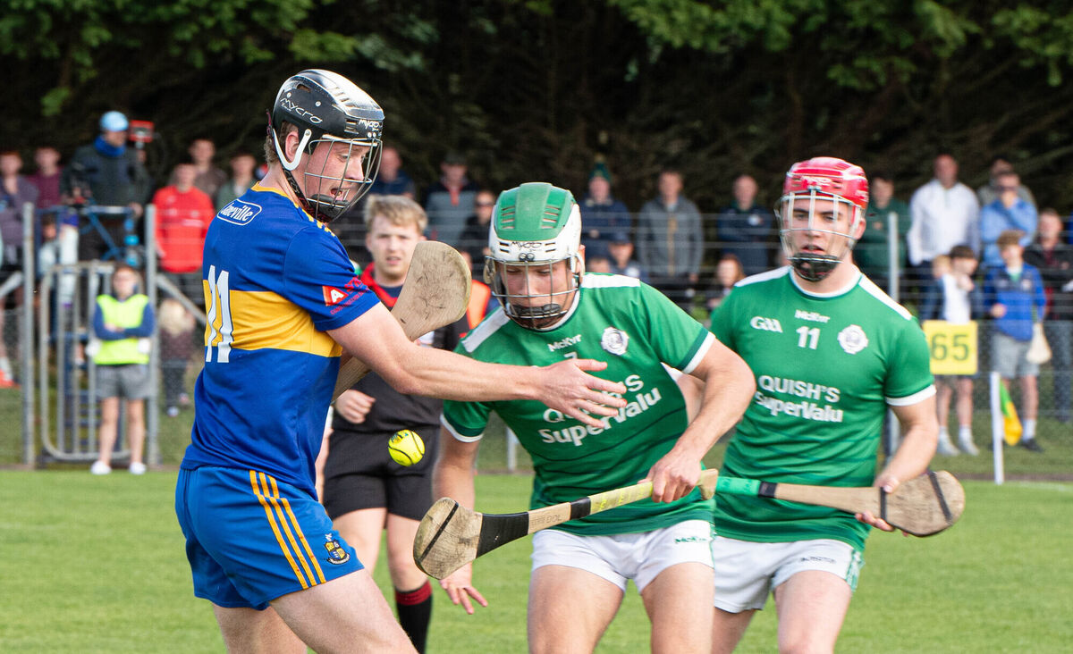 Carrigaline's Patrick Mellett and Ballincollig's David O'Leary tussle for a loose ball. Picture: Howard Crowdy Carrigaline's Patrick Mellett and Ballincollig's David O'Leary tussle for a loose ball. Picture: Howard Crowdy