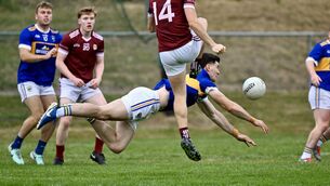 <p> Kilshannig defender Colm O’Shea went full stretch to block a kick by Gary Holland, Bishopstown, at Mallow GAA. Picture: Larry Cummins</p>