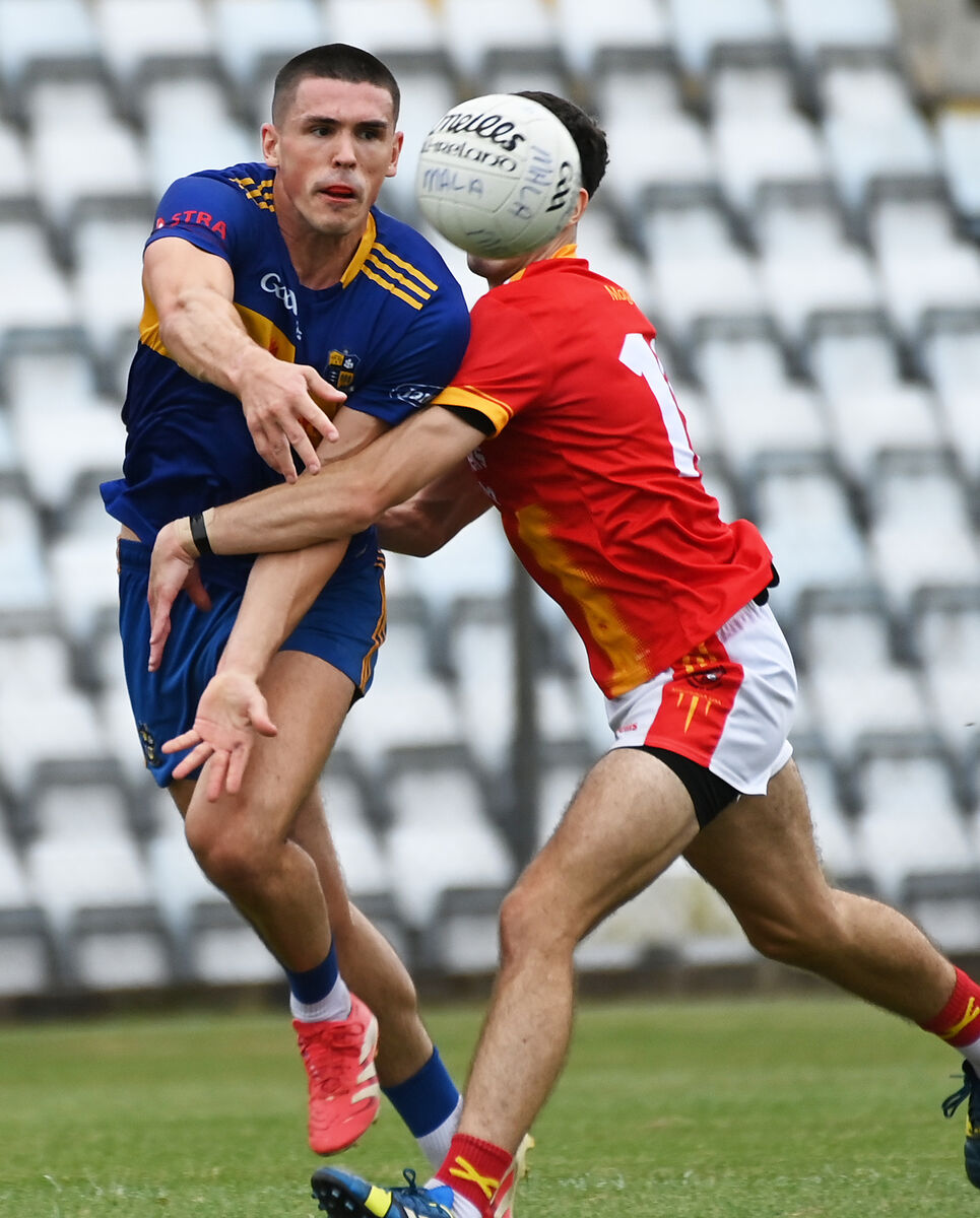 Carrigaline's David Griffin is tackled by Mallow's Cathal Mullins. Picture: Eddie O'Hare