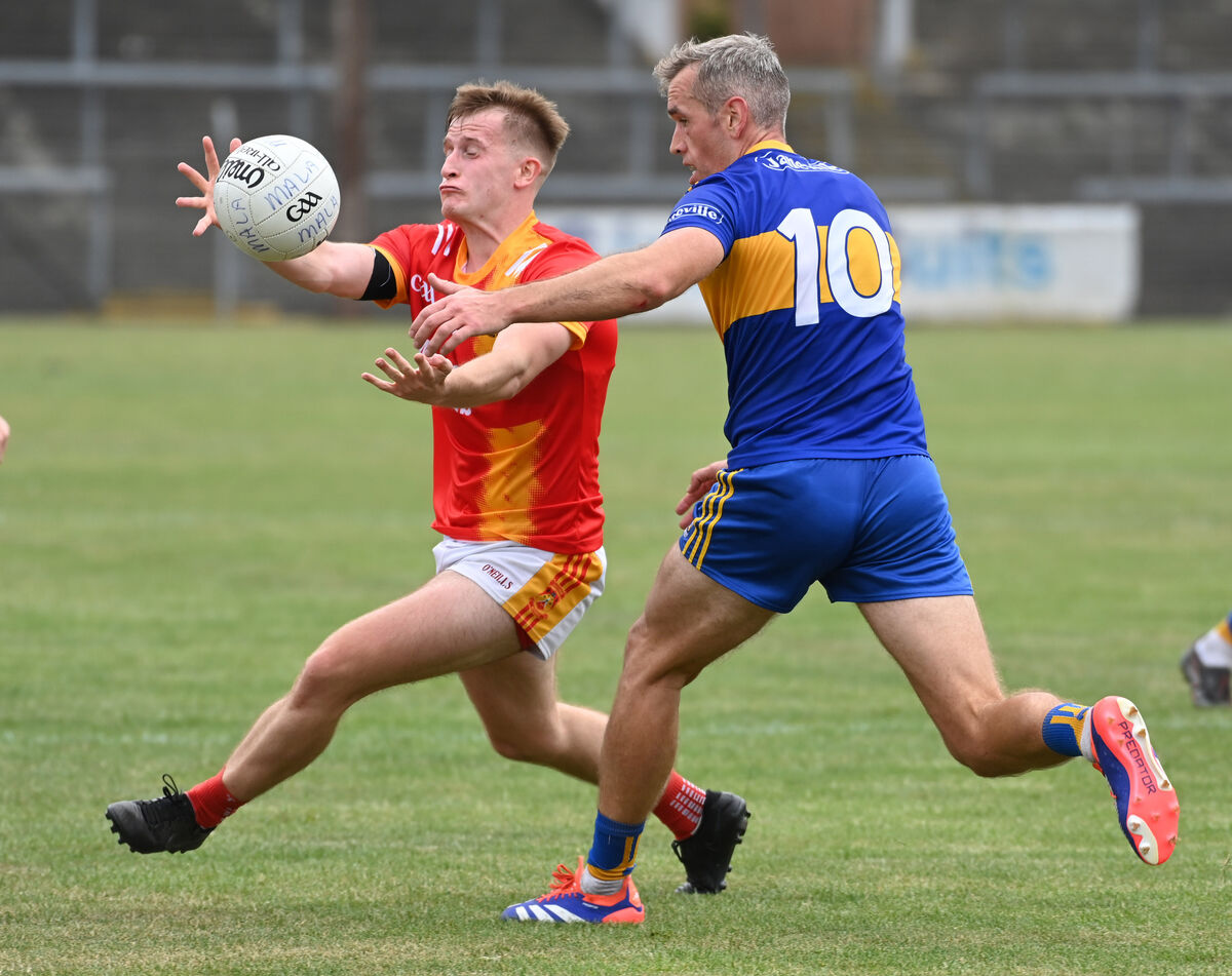Mallow's Eoghan Barry is tackled by Carrigaline's Niall Coakley. Picture: Eddie O'Hare