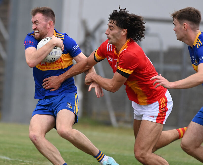 Carrigaline's Cian Barry breaks from Mallow's Shane Merritt. Picture: Eddie O'Hare Carrigaline's Cian Barry breaks from Mallow's Shane Merritt. Picture: Eddie O'Hare