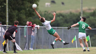 <p>RISING HIGH: Alan Walsh, Kanturk, reaches for the ball to stop it going over the side line under pressure from Adam O'Donovan, Dohenys. Picture: Jim Coughlan.</p> <p>RISING HIGH: Alan Walsh, Kanturk, reaches for the ball to stop it going over the side line under pressure from Adam O'Donovan, Dohenys. Picture: Jim Coughlan.</p>