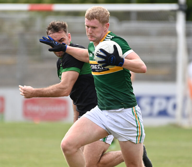 St Michael's Rory O'Shaughnessy holds off Nemo Rangers' Kieran Histon. Picture: Eddie O'Hare