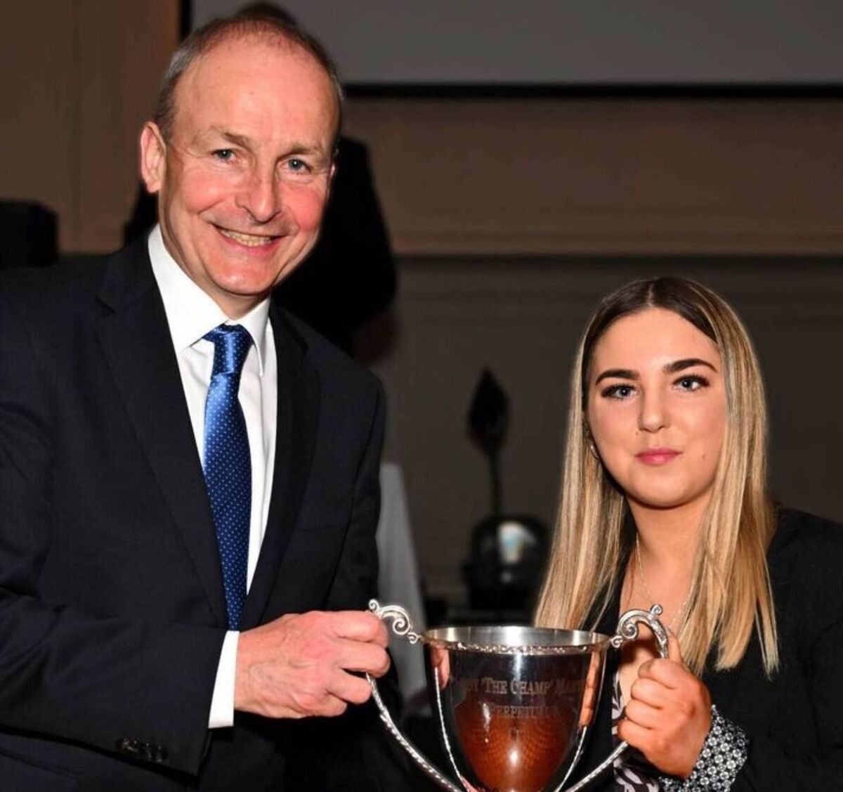 An Taoiseach Michael Martin presents the Paddy Martin Cup to boxer Katie O'Keeffe. An Taoiseach Michael Martin presents the Paddy Martin Cup to boxer Katie O'Keeffe.