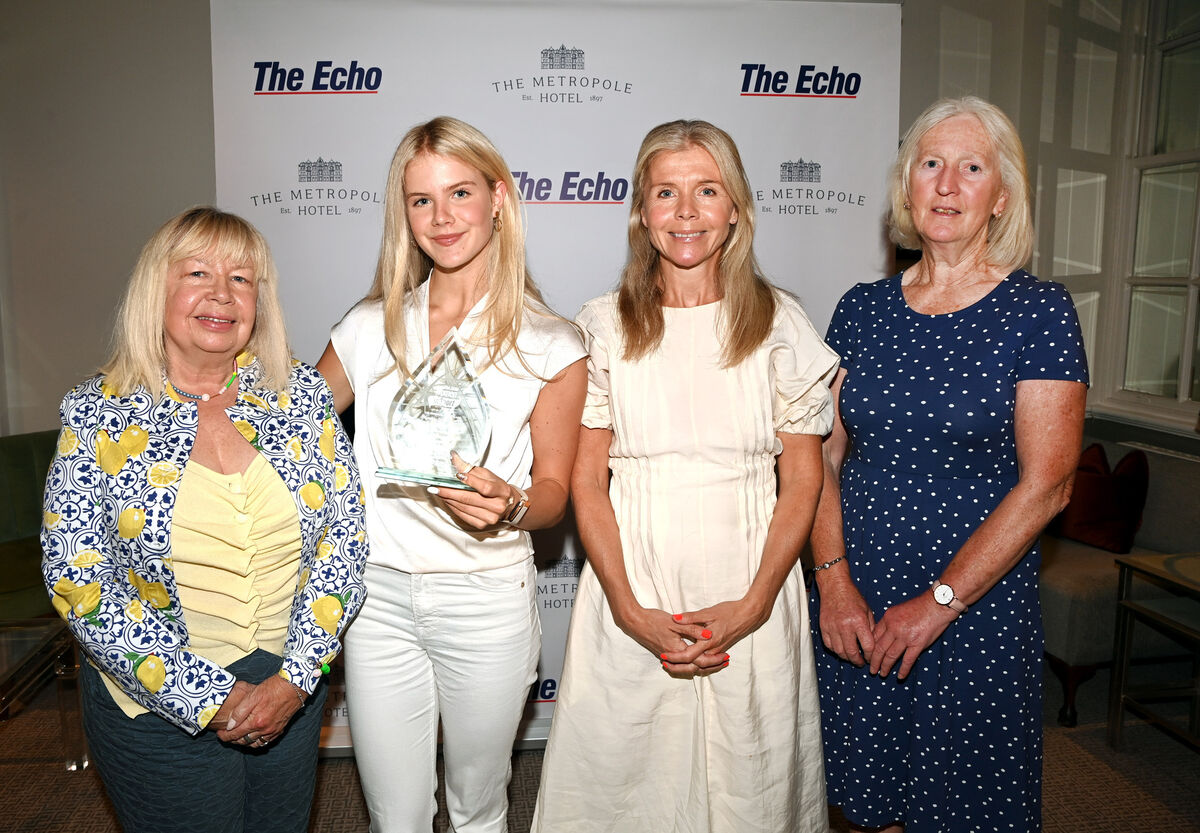 Elle-Kate McRae, with her grandmother, Kathleen Holland; mother, Michelle McRae, and coach Joan Hough at the presentation ceremony. Picture: Eddie O'Hare