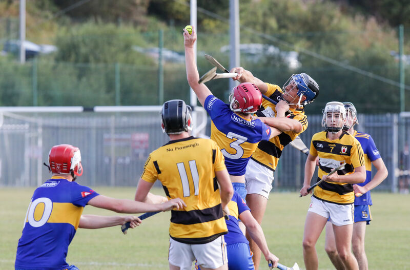Carrigaline's Jerry Scannell makes a fine catch while under pressure against Na Piarsaigh. Picture: David Creedon
