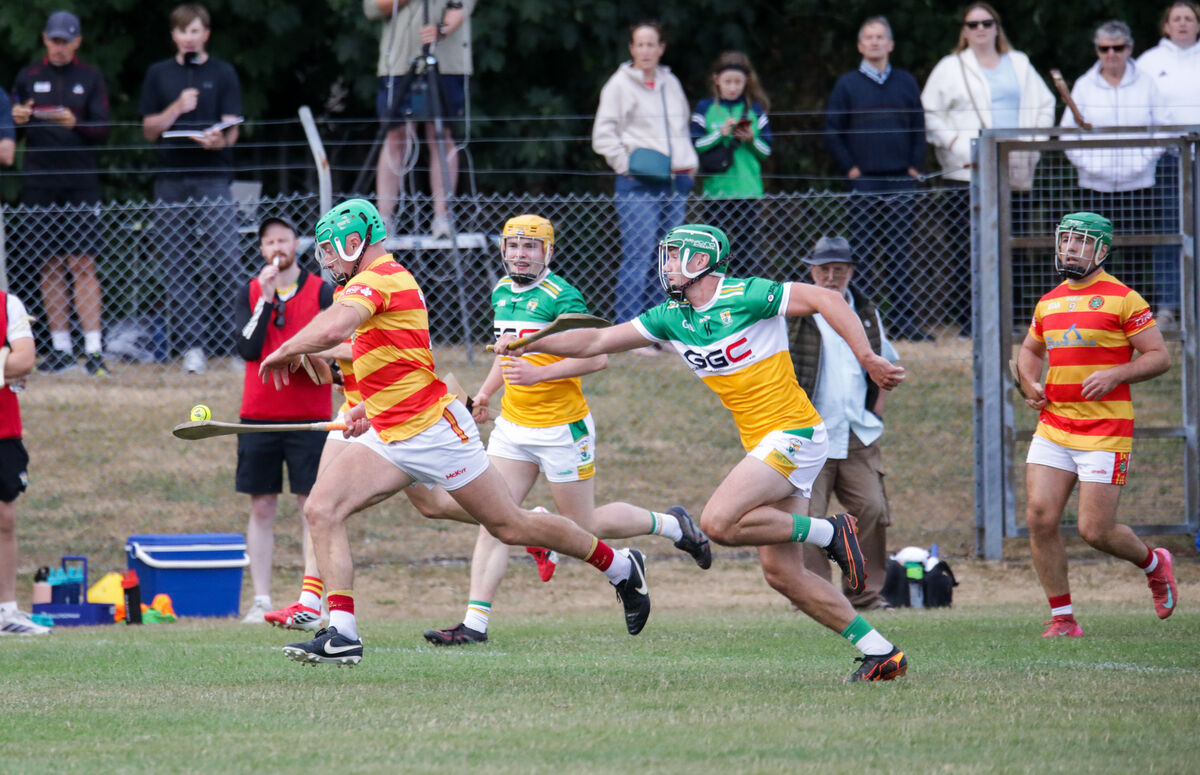Newcestown's Colm O'Donovan breaks away from Bride Rovers' Brian Roche. Picture: David Creedon