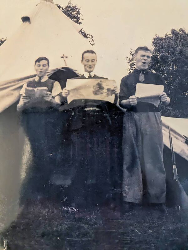 Barry, Joe, and Michael Holly singing while camping in the Point Field in Courtmacsherry. Joe was the choirmaster at the SMA church in Wilton Barry, Joe, and Michael Holly singing while camping in the Point Field in Courtmacsherry. Joe was the choirmaster at the SMA church in Wilton