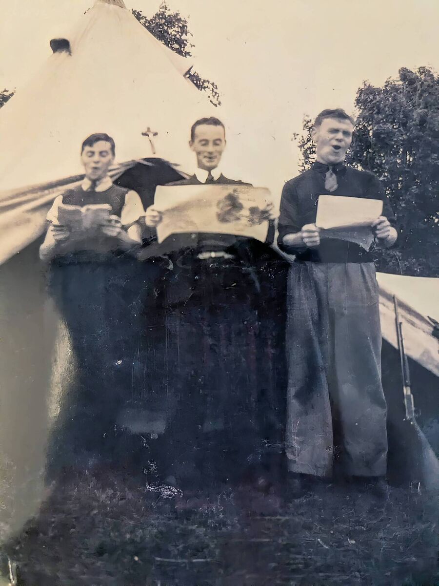 Barry, Joe, and Michael Holly singing while camping in the Point Field in Courtmacsherry. Joe was the choirmaster at the SMA church in Wilton