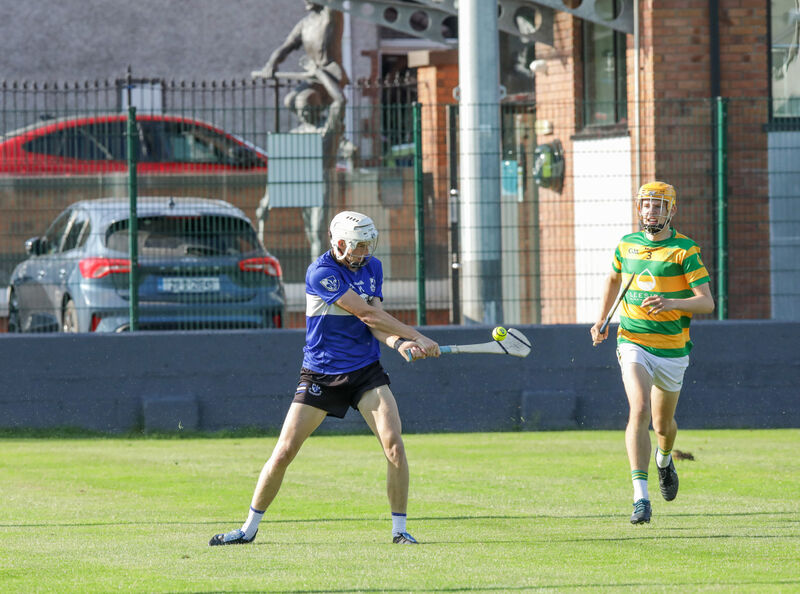  Sars' Adam Dunlea shoots at goal watched on by Blackrock's Patrick McCarthy. Picture: David Creedon