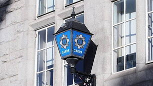 Garda charged with soliciting murder of woman and three children Garda charged with soliciting murder of woman and three children