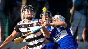 <p>Midleton’s Max Murphy is put under pressure by Sars' Adam Dunlea in the Rebel Óg Premier 1 MHC game. Picture: Chani Anderson</p>