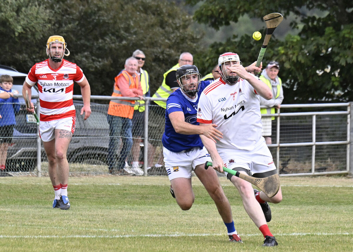 Courcey Rovers goalkeeper Stephen Nyhan clears downfield from Ballinhassig's Michael Collins in their game three weeks ago - Nyhan scored a dramatic late equaliser. Picture: Martin Walsh