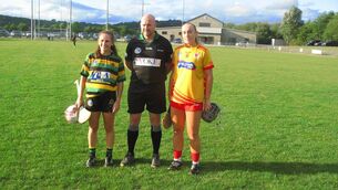 <p>Referee Andrew Larkin accompanied by captains Katie Walsh (Glen Rovers) and Isobel Sheehan (Éire Óg) before the opening round of the Cork camogie championship.</p> <p>Referee Andrew Larkin accompanied by captains Katie Walsh (Glen Rovers) and Isobel Sheehan (Éire Óg) before the opening round of the Cork camogie championship.</p>