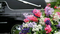 Funeral Concepts: Hearse and Flowers