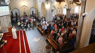 Hundreds gather in vigil for family injured in M9 crash