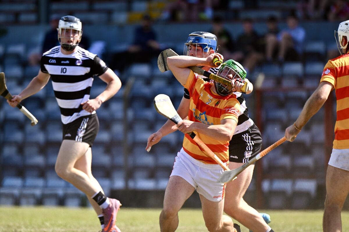 Micheál McSweeney of Newcestown is caught by a high challenge from Conor Morley of Midleton. Picture: Larry Cummins Micheál McSweeney of Newcestown is caught by a high challenge from Conor Morley of Midleton. Picture: Larry Cummins