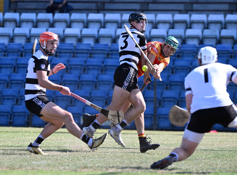Midleton defender Tadhg O'Leary-Hayes takes the sting out of a shot on goal by Seán O'Donovan of Newcestown. Picture: Larry Cummins Midleton defender Tadhg O'Leary-Hayes takes the sting out of a shot on goal by Seán O'Donovan of Newcestown. Picture: Larry Cummins