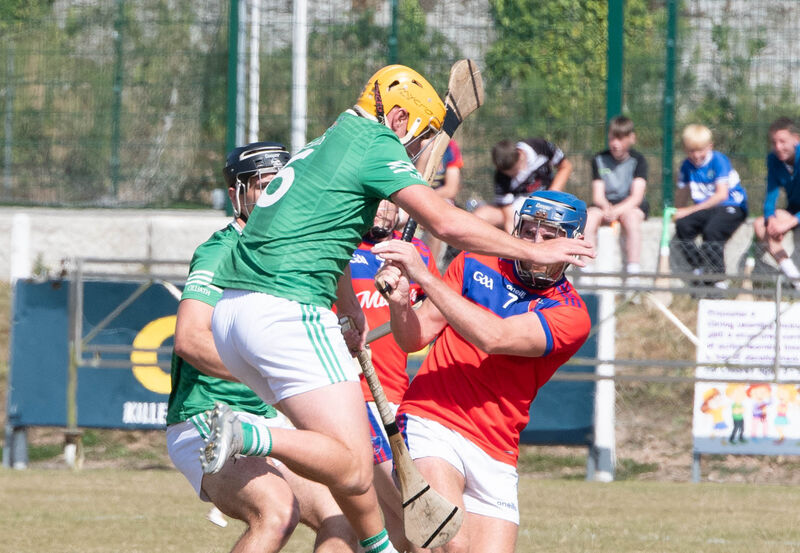 Killeagh's Brendan Delaney blocks Erin's Own's Cormac Dooley. Picture: Howard Crowdy