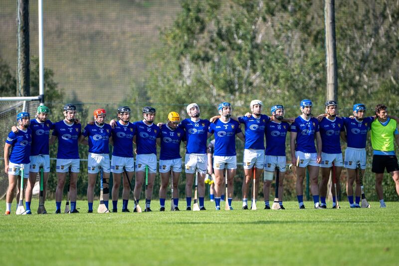 Ballinhassig’s players stand to attention for Amhrán na bhFiann ahead of their SAHC clash with Inniscarra. Picture: Chani Anderson