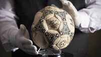 Maradona’s ‘Hand of God’ football sold at auction