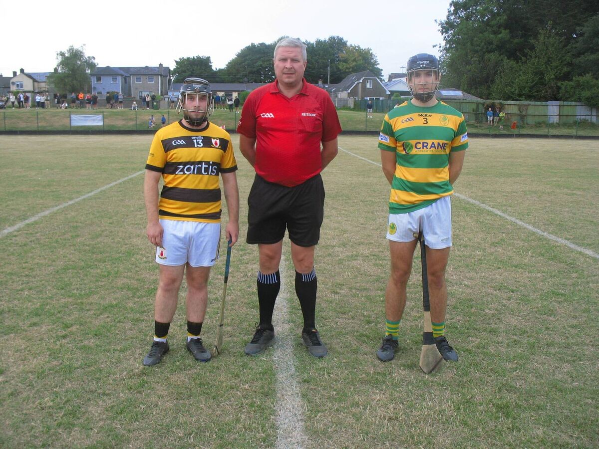 Referee Cormac Dineen accompanied by Michael Sheehan (Na Piarsaigh) and Tom Harrington (Blackrock) at Ballinlough. Referee Cormac Dineen accompanied by Michael Sheehan (Na Piarsaigh) and Tom Harrington (Blackrock) at Ballinlough.